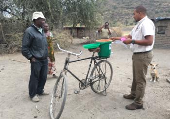 Placed on the back of a bicycle, one of the water filters we gave away. Photo by Matt Norton